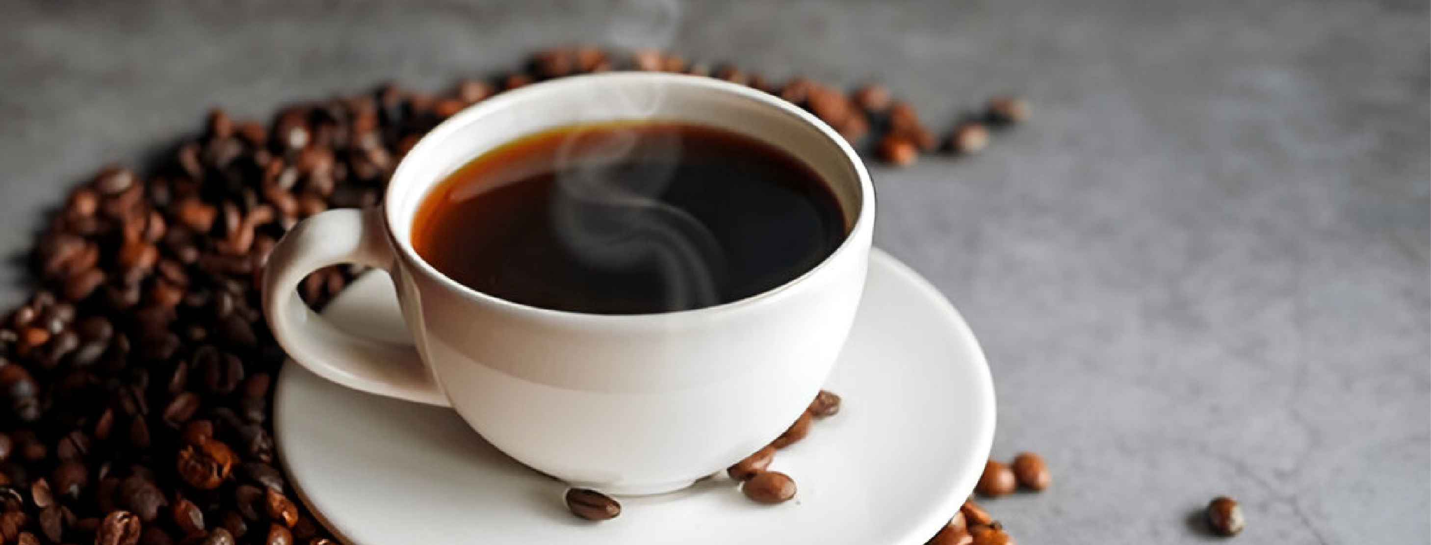 cup of hot coffee and coffee beans