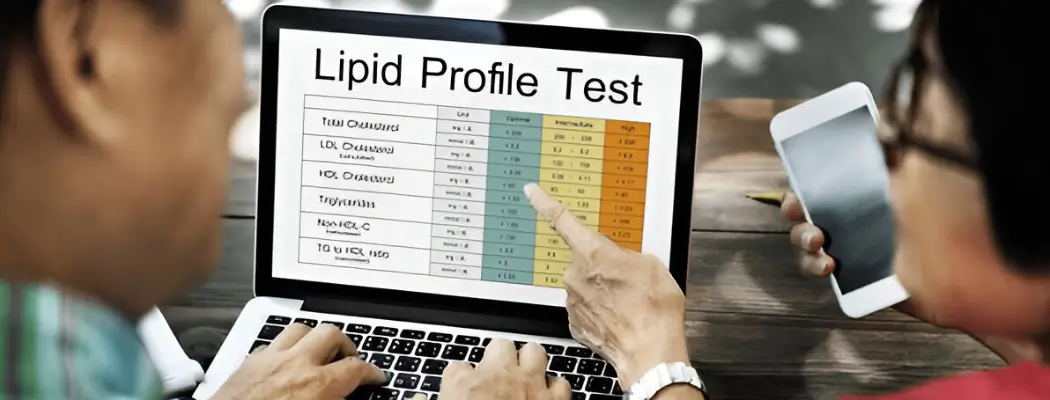 People reviewing lipid profile test results on a laptop