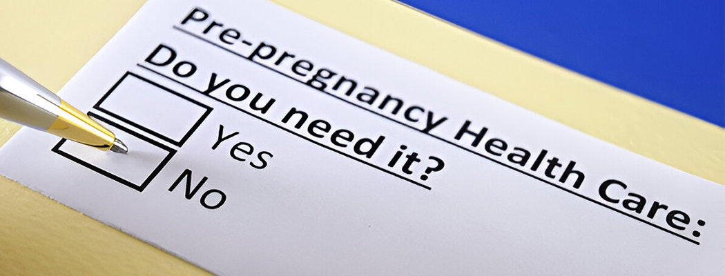Pre-pregnancy healthcare form with pen pointing to No checkbox