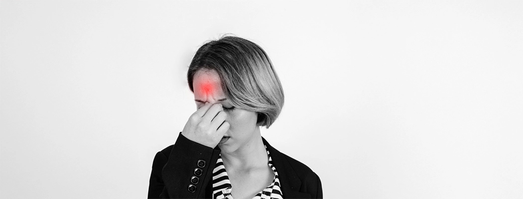 Young woman holding head in frustration