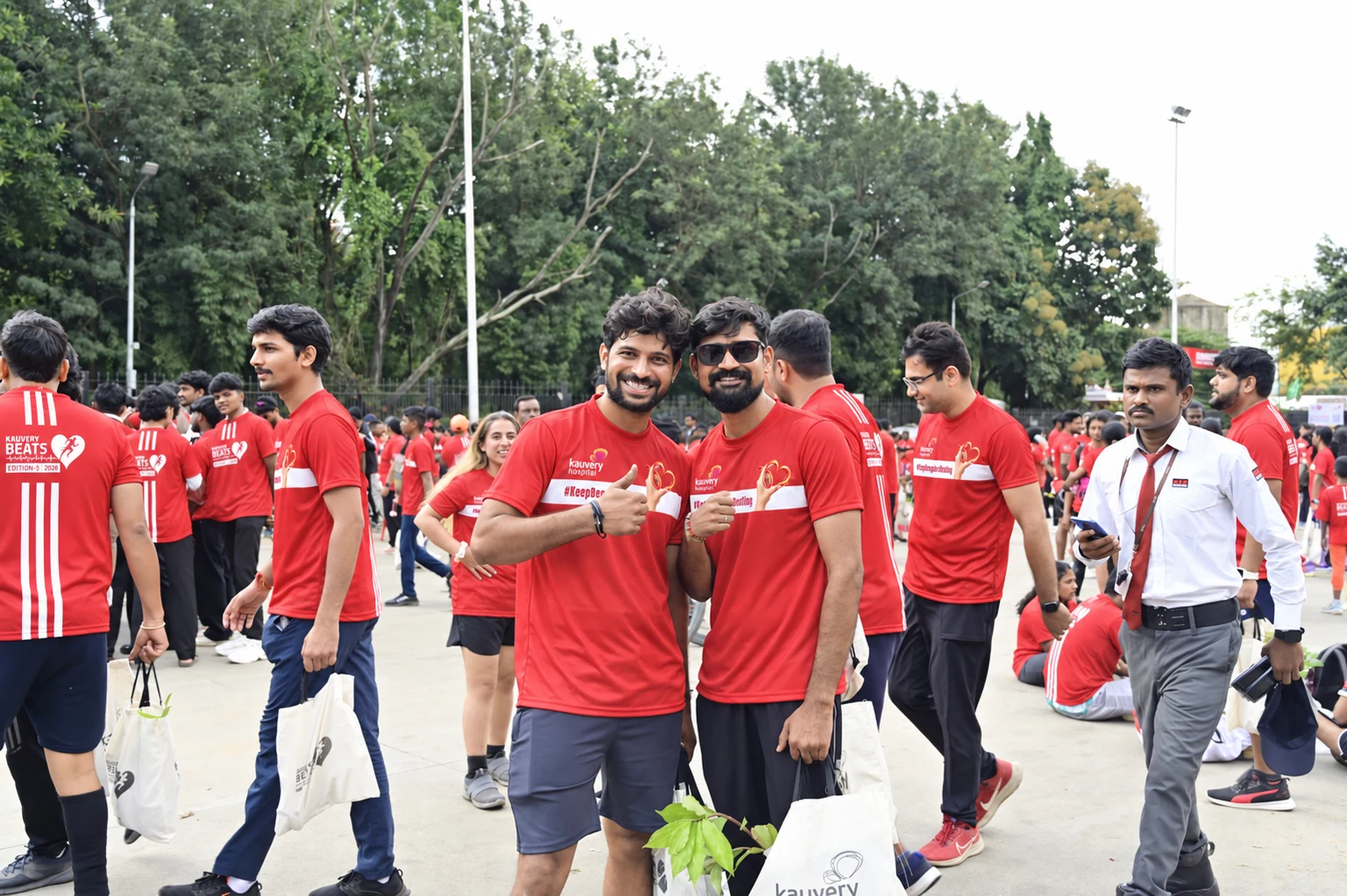 Two BEATS participants celebrate together at a previous event; photograph adapted with the supplied campaign jersey